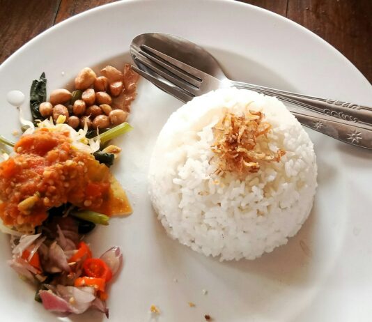체중 증가 예방을 위한 식습관 개선 a white plate topped with rice and beans